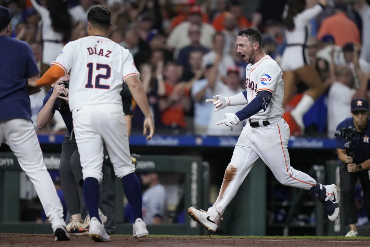 Houston Astros' Alex Bregman celebrates after hitting a walk-off home run during the ninth inning of a baseball game against the Los Angeles Dodgers in Houston July 27, 2024. (Kevin M. Cox/AP Photo)