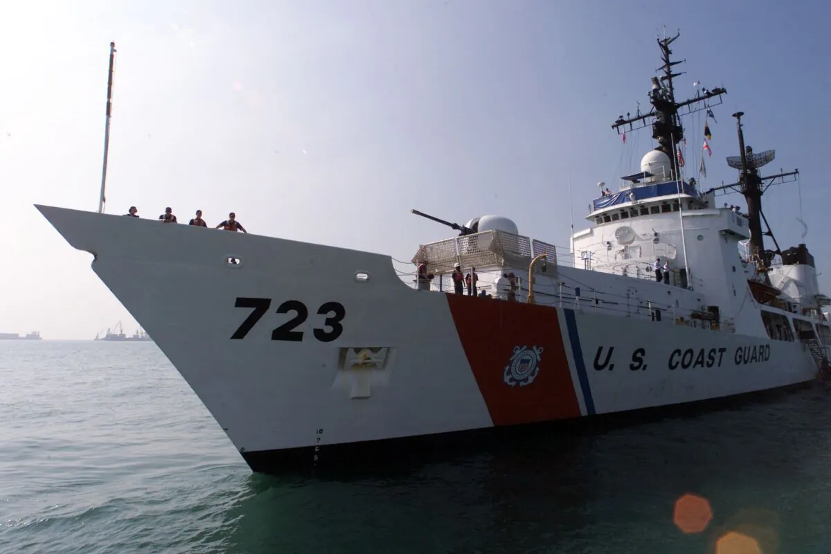 Crew members look out from the U.S. Coast Guard Cutter "Rush" before the start of a rescue exercise on Dec. 6, 2000. The U.S. Coast Guard, the Chinese PLA and Hong Kong Government Flying Services took part in the annual Search and Rescue Exercise, SAREX 2000. (Peter Parks/AFP via Getty Images)