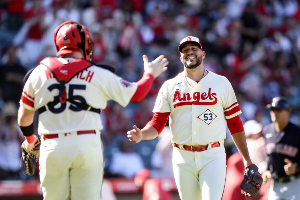 Chad Wallach (L) (35) and Carlos Estevez (53) of the Los Angeles Angels celebrate after defeating the Cleveland Guardians in Anaheim, Calif., on Sept. 10, 2023. (Meg Oliphant/Getty Images)