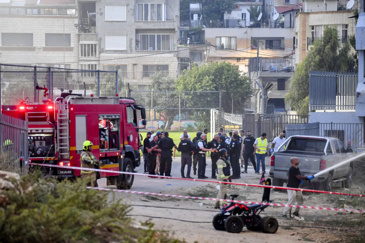 Israeli officials respond after rockets were launched across Lebanon’s border that Israel says killed 11 people in Majdal Shams, Golan Heights, Israel, on July 27, 2024. (Gil Eliyahu/Reuters)