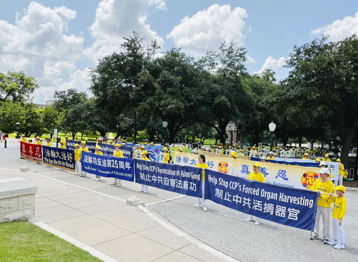 Falun Gong practitioners hold a rally outside the Texas State Capitol building in Austin on July 20, 2024. (Wu Xianglian/The Epoch Times)
