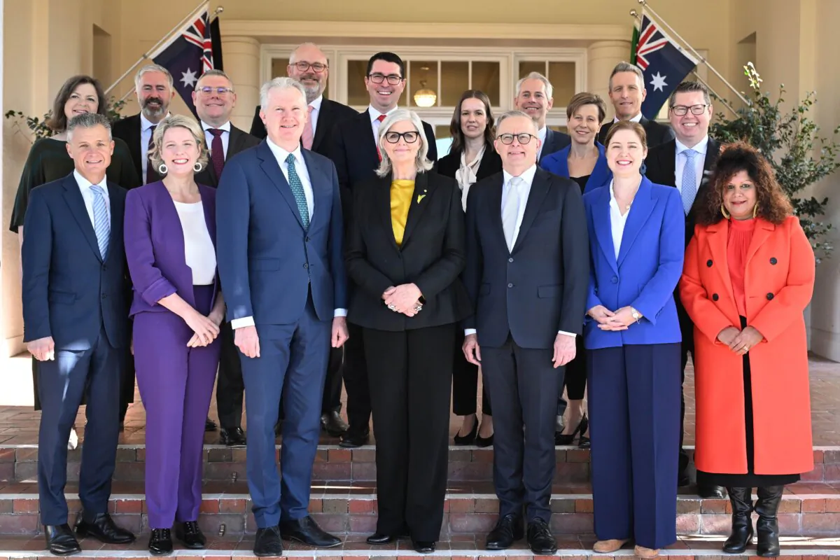Australian Governor-General Sam Mostyn and Australian Prime Minister Anthony Albanese pose for photographs with newly sworn in members of the federal cabinet ministry during a swearing in ceremony at Government House in Canberra, Australia on July 29, 2024.  (AAP Image/Lukas Coch) 