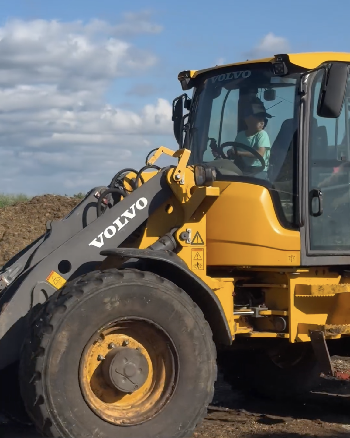Hans confidently drives the tractor on the family farm. (Courtesy of Devon Fenner @fennerfarms)
