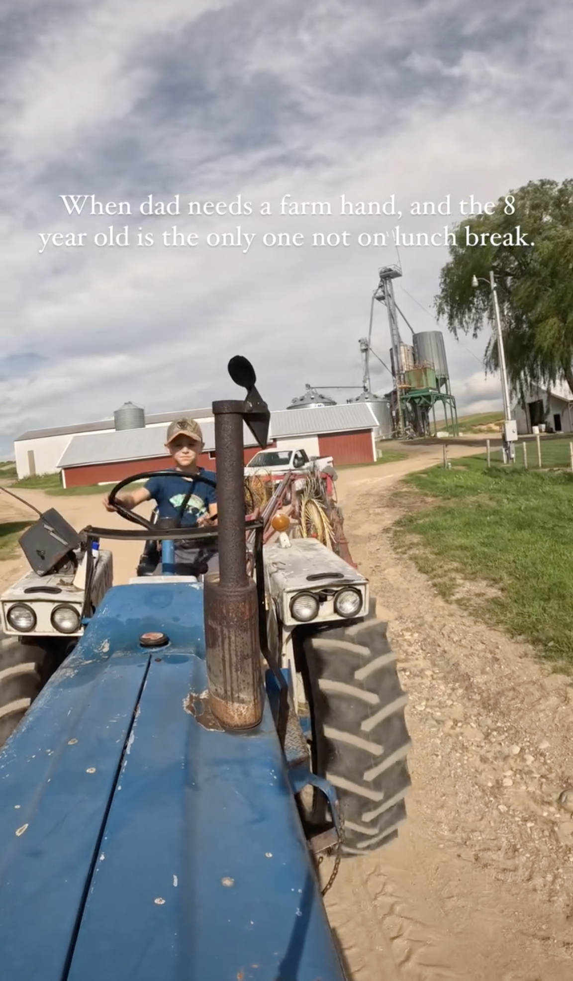 Screenshot of Hans driving an old ford tractor.