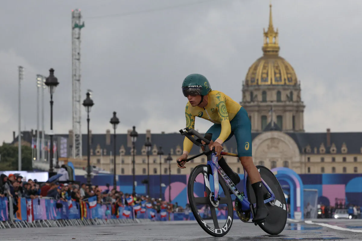 Australia's Lucas Plapp cycles past Invalides as he competes in the men's road cycling individual time trial during the Paris 2024 Olympic Games in Paris on July 27, 2024. (Emmanuel Dunand/AFP via Getty Images)