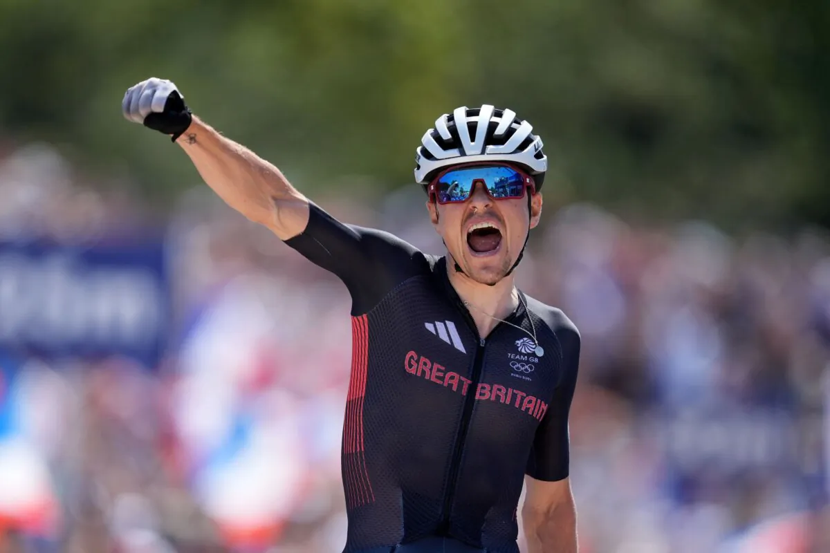 Mountain biker Tom Pidcock punches the air as he wins gold in the men’s cross-country mountain biking at the Paris Olympic Games on July 29, 2024. (Martin Rickett/PA)