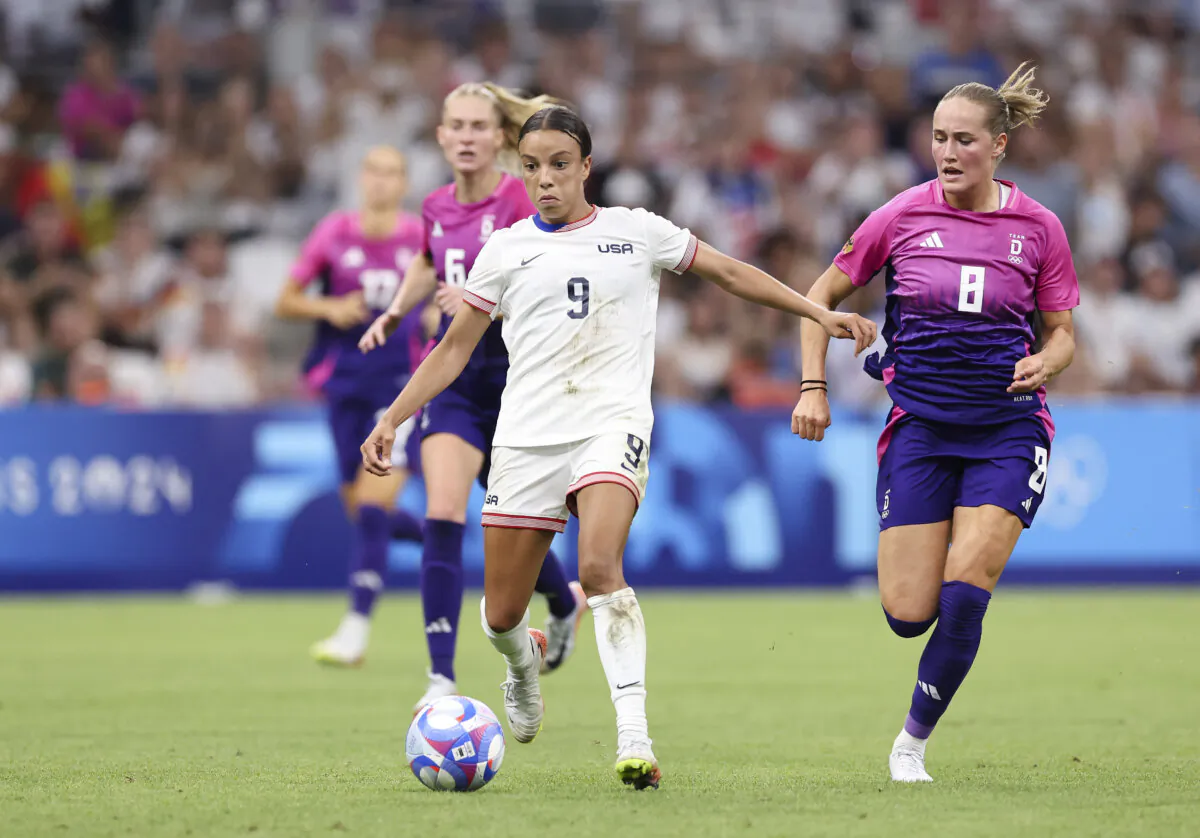 Mallory Swanson #9 of Team United States beats Sydney Lohmann #8 of Germany during the Women's group B match between the United States and Germany during the Olympic Games Paris 2024 at Stade de Marseille in France on July 28, 2024. (Alex Livesey/Getty Images)