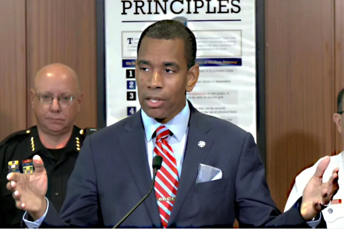 This still image taken from video shows Rochester Mayor Malik Evans, accompanied by Police Chief David Smith (L), as he addresses a news conference, in Rochester, New York, on July 29, 2024. (Rochester N.Y. Police Department via AP)