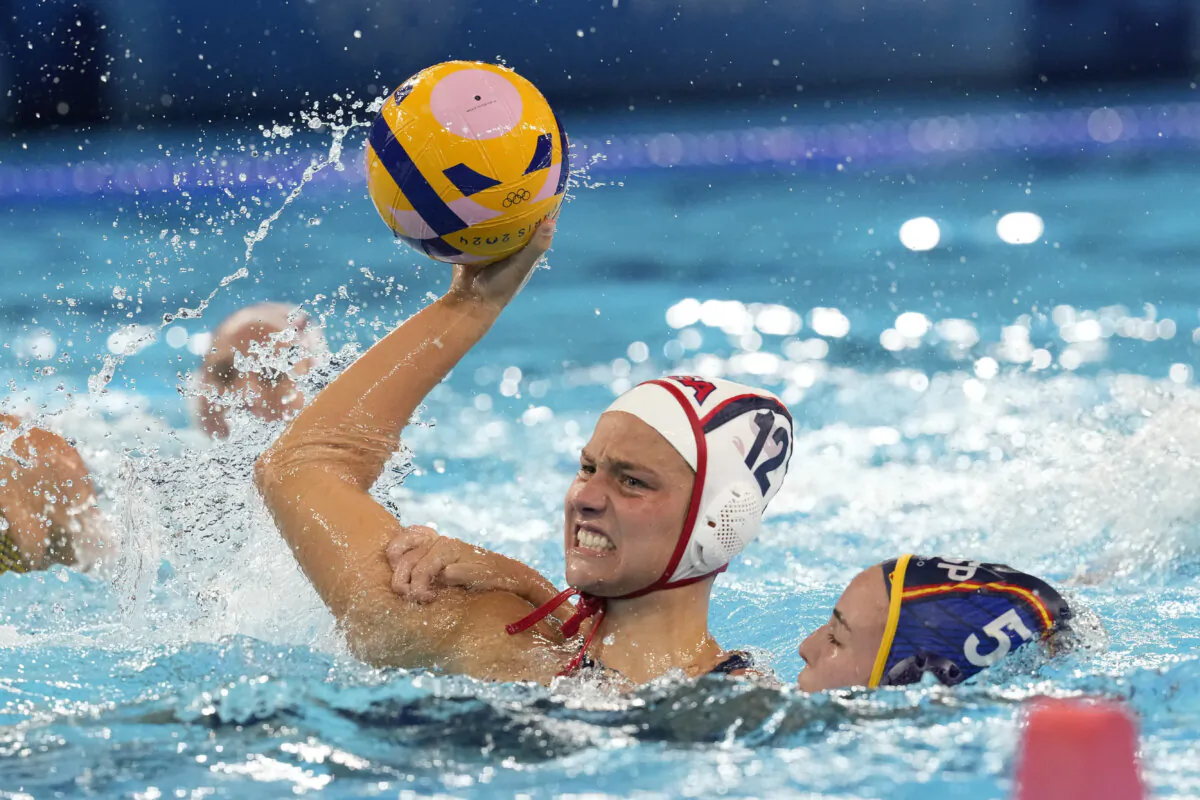 United States' Jovana Sekulic (L) and Spain's Nona Perez Vivas battle for the ball during a women's water polo Group B preliminary match between USA and Spain at the 2024 Summer Olympics in Saint-Denis, France, on July 29, 2024. (Luca Bruno/AP Photo)