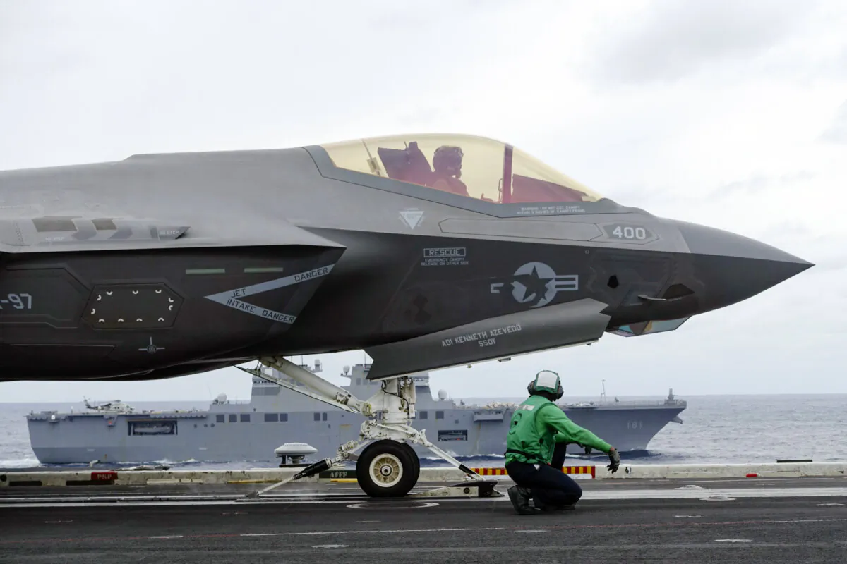 U.S. Navy’s F-35C stealth fighter jet and crew prepare ready for takeoff for a flight demonstration during the Annualex 23 joint naval exercise, from aircraft carrier USS Carl Vinson off the Japanese coast on Nov. 11, 2023. (Mari Yamaguchi/AP Photo)