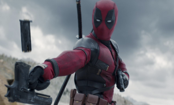 man in red costume with two pistols in DEADPOOL & WOLVERINE 