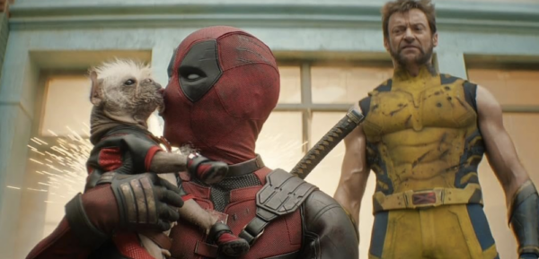 man in red costume and man in yellow costume and small dog in DEADPOOL & WOLVERINE 