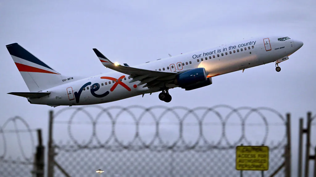 A Rex Airlines Boeing 737 departs Tullamarine Airport in Melbourne, Australia, on July 29, 2024. (William West/AFP via Getty Images)