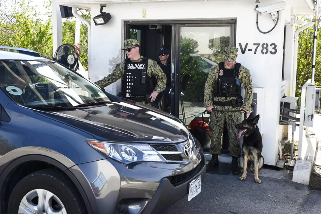 Navy security personnel check a driver’s identification card at a security gate leading to Naval Air Station Key West on Feb. 7, 2018. (U.S. Navy Photo by Mass Communication Specialist 2nd Class Cody R. Babin/Released)
