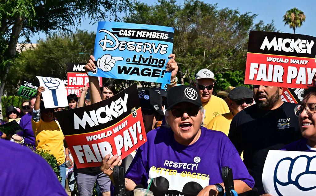 Disney employees rally outside the main entrance of Disneyland Resort in Anaheim, Calif., on July 17, 2024, ahead of a planned strike authorization vote. (Frederic J. Brown/AFP via Getty Images)