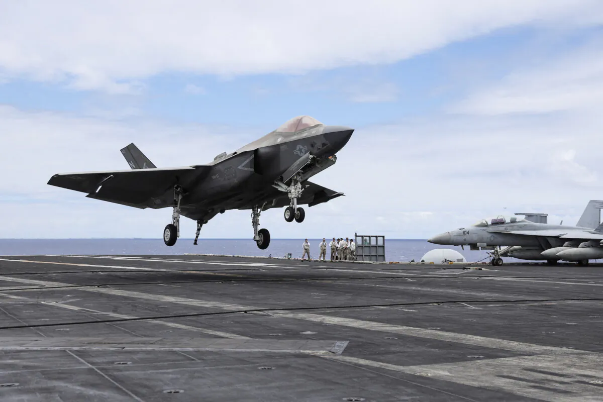 An F-35 jet lands on the runway of the USS Carl Vinson aircraft carrier during the Rim of the Pacific (RIMPAC) military exercises, about 100 miles south of Oahu, Hawaii, on July 19, 2024. (Marco Garcia/File Photo/Reuters)