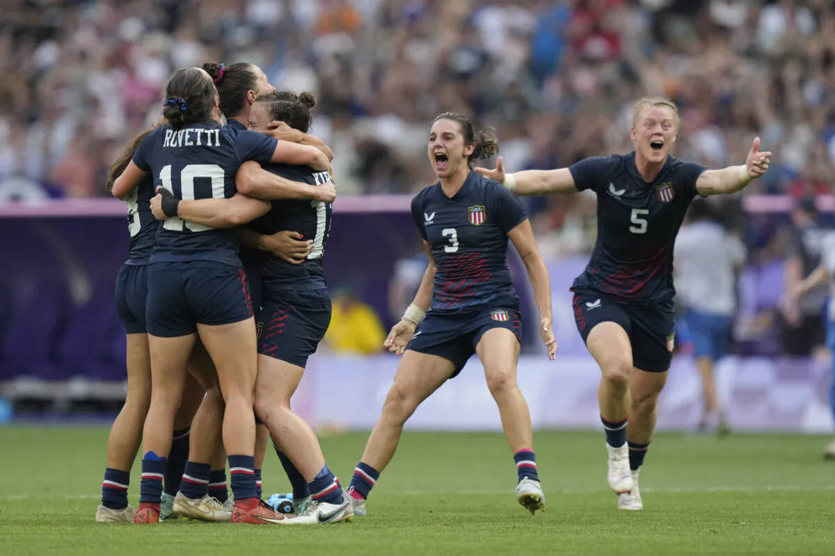 The United States team celebrate after winning the women's bronze medal Rugby Sevens match between the United States and Australia at the 2024 Summer Olympics, in the Stade de France, in Saint-Denis, France, on July 30, 2024. (Vadim Ghirda/AP Photo)