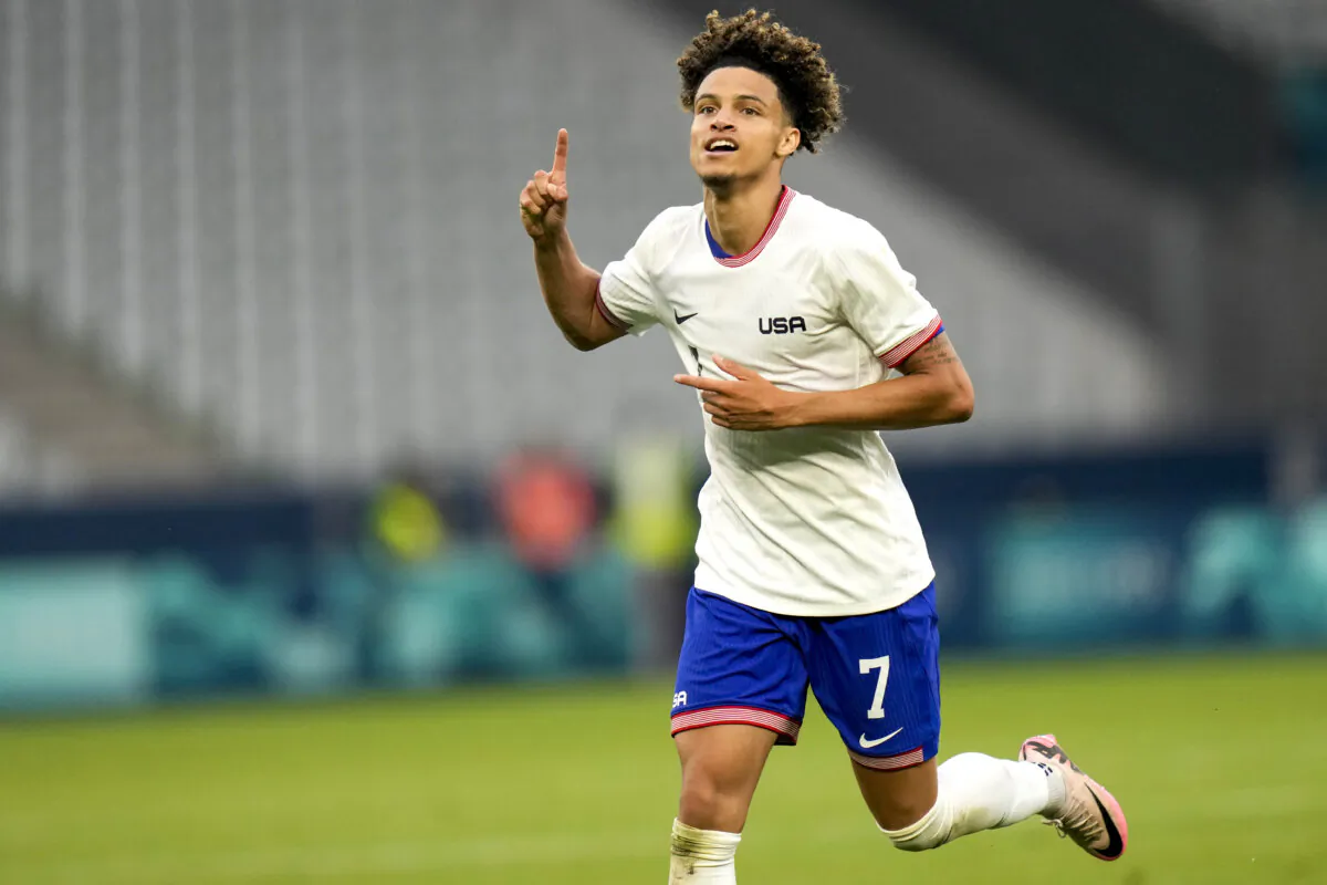 Kevin Paredes celebrates scoring the United States' third goal during a Summer Olympics men's soccer match against Guinea in Saint-Etienne, France, on July 30, 2024. (Silvia Izquierdo/AP Photo)