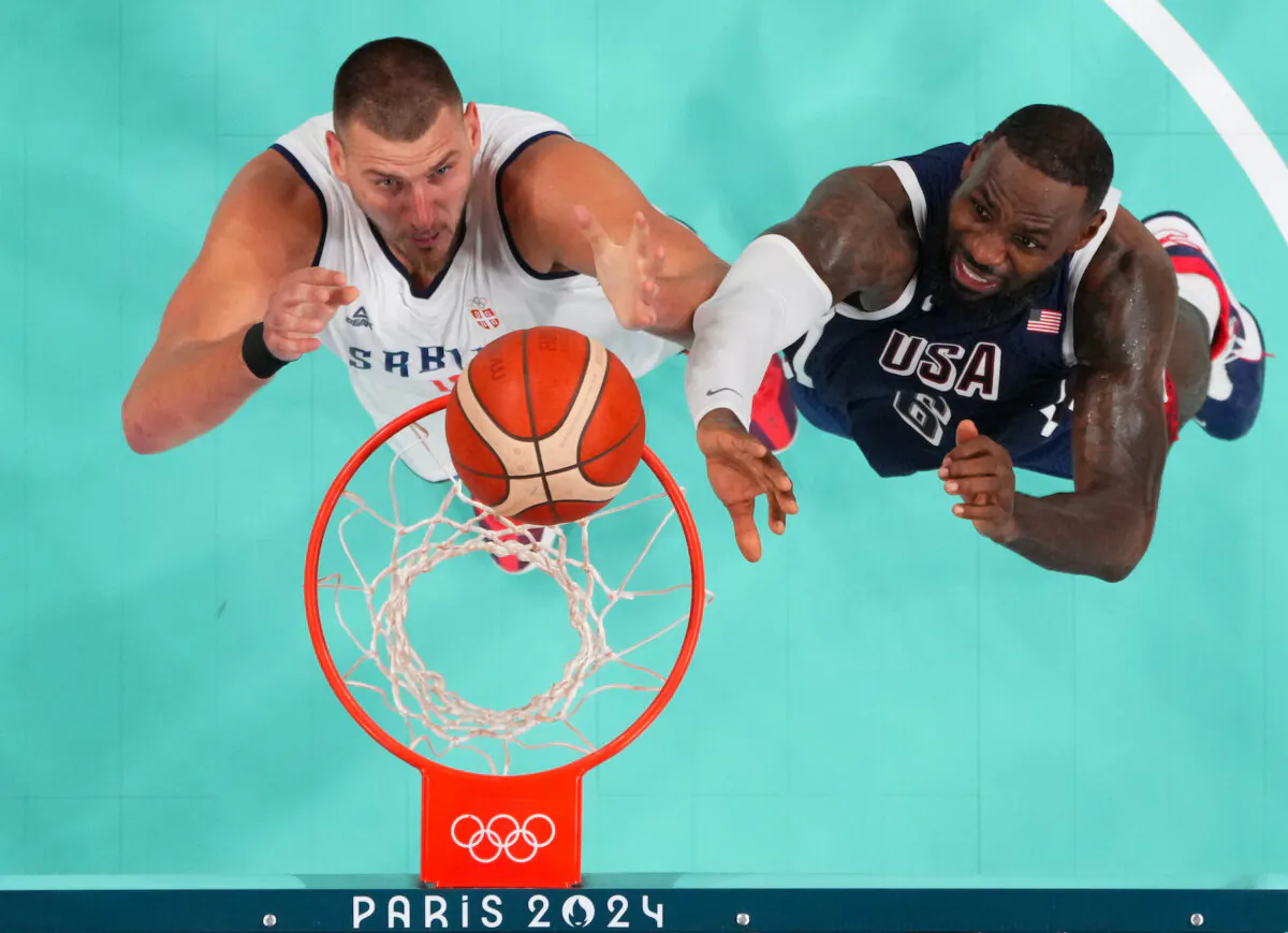 Nikola Jokic #15 of Team Serbia and Lebron James #6 of Team United States fight for a rebound during the second half of the game between Serbia and the United States on day two of the Olympic Games Paris 2024 at Stade Pierre Mauroy in Lille, France on July 28, 2024. (Pool/Getty Images)