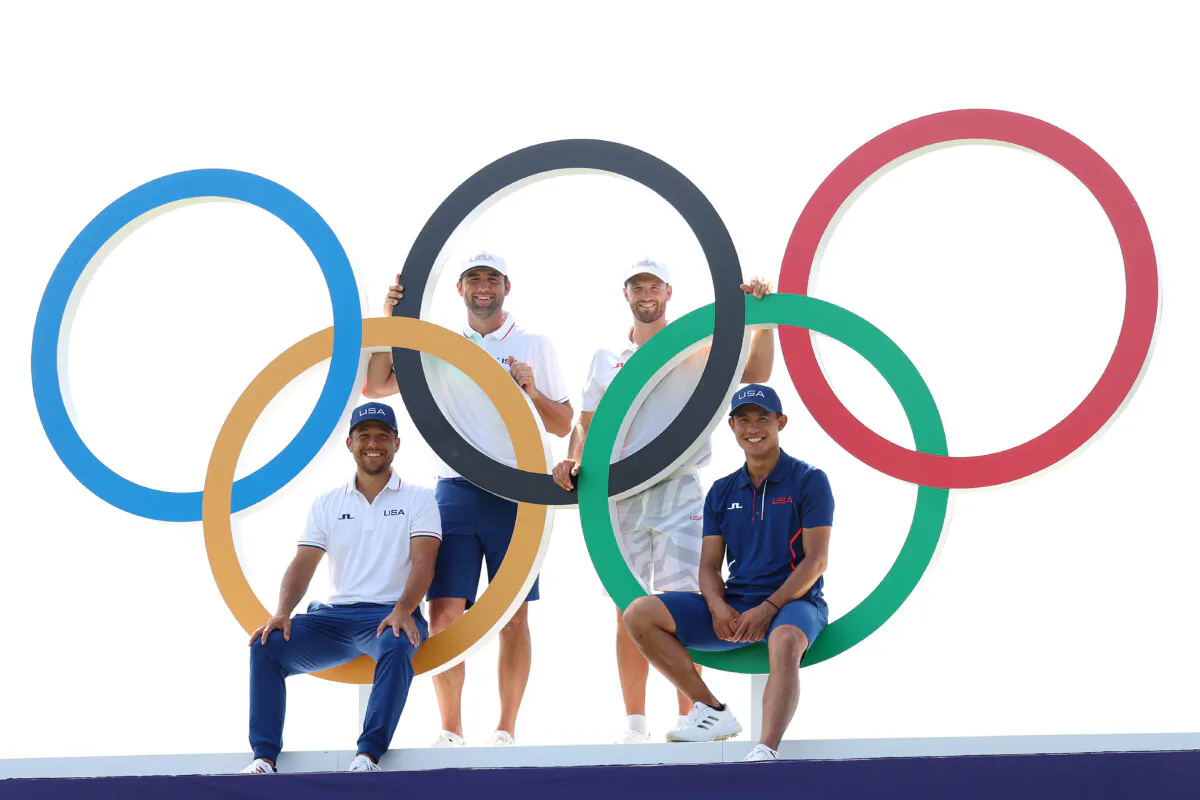 Team United States pose for a photo with the Olympic rings on the 18th hole during a practice round on day five of the Olympic Games Paris 2024 at Le Golf National  in Paris, France, on July 31, 2024. (Andrew Redington/Getty Images)