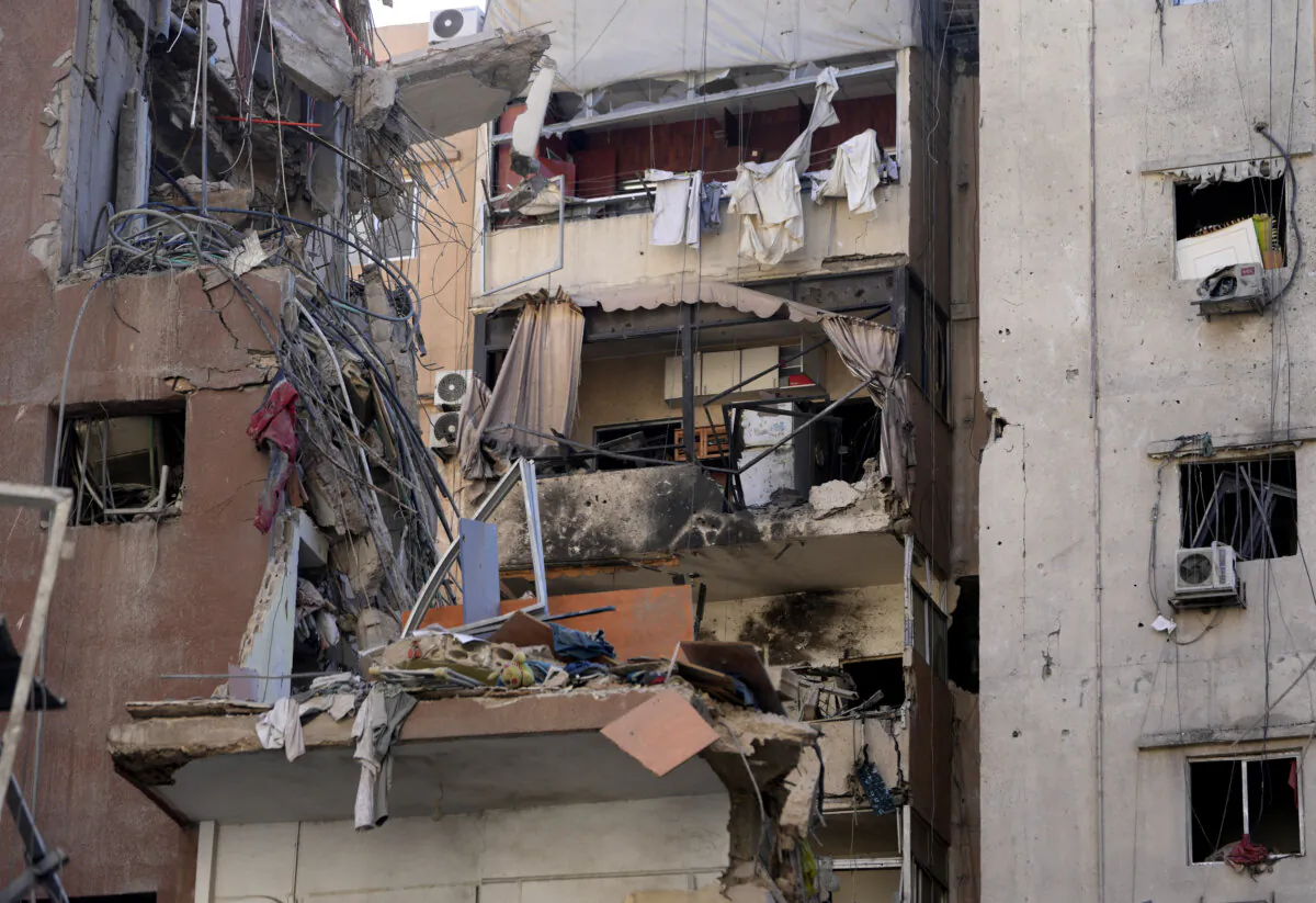 Buildings are damaged after being hit by an Israeli airstrike on July 30 evening in the southern suburbs of Beirut, Lebanon, on July 31, 2024. (The Canadian Press/AP/Hussein Malla)
