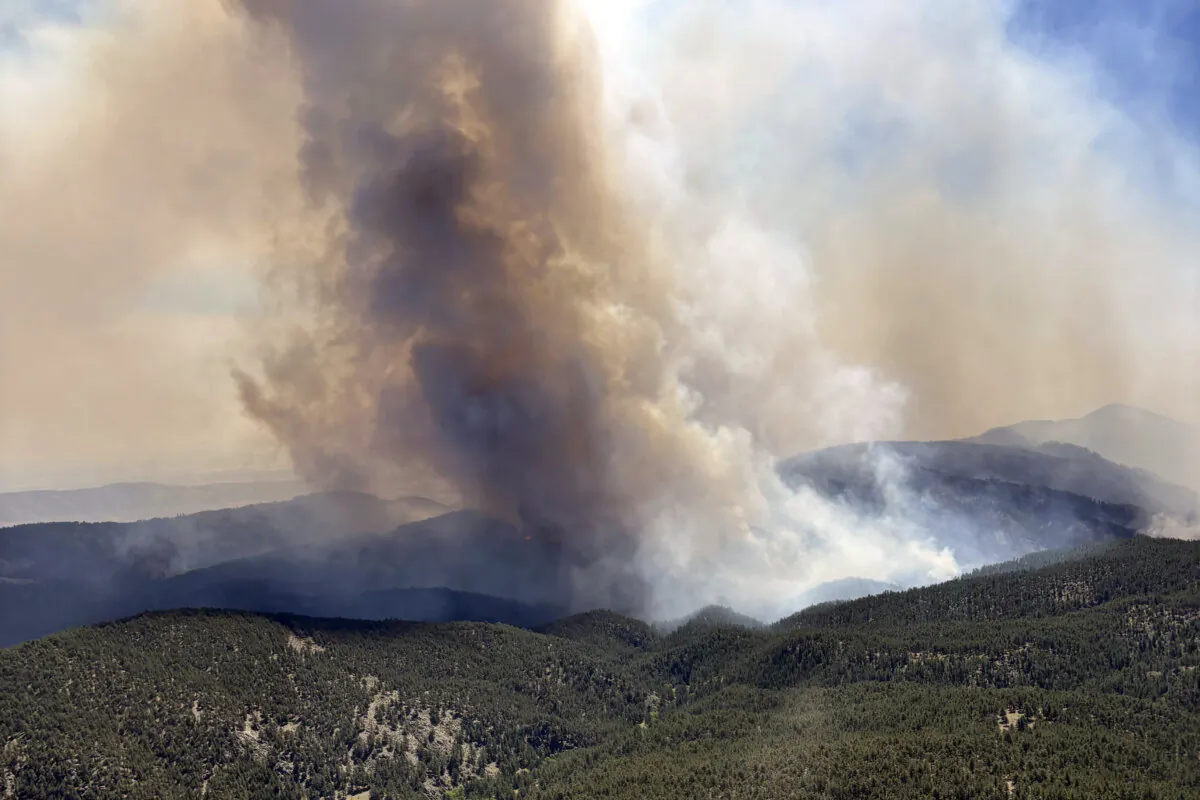 This image provided by the USDA Forest Service shows the Alexander Mountain Fire near Loveland, Colo., Tuesday, July 30, 2024.  (Jason Sieg/USDA Forest Service via AP)