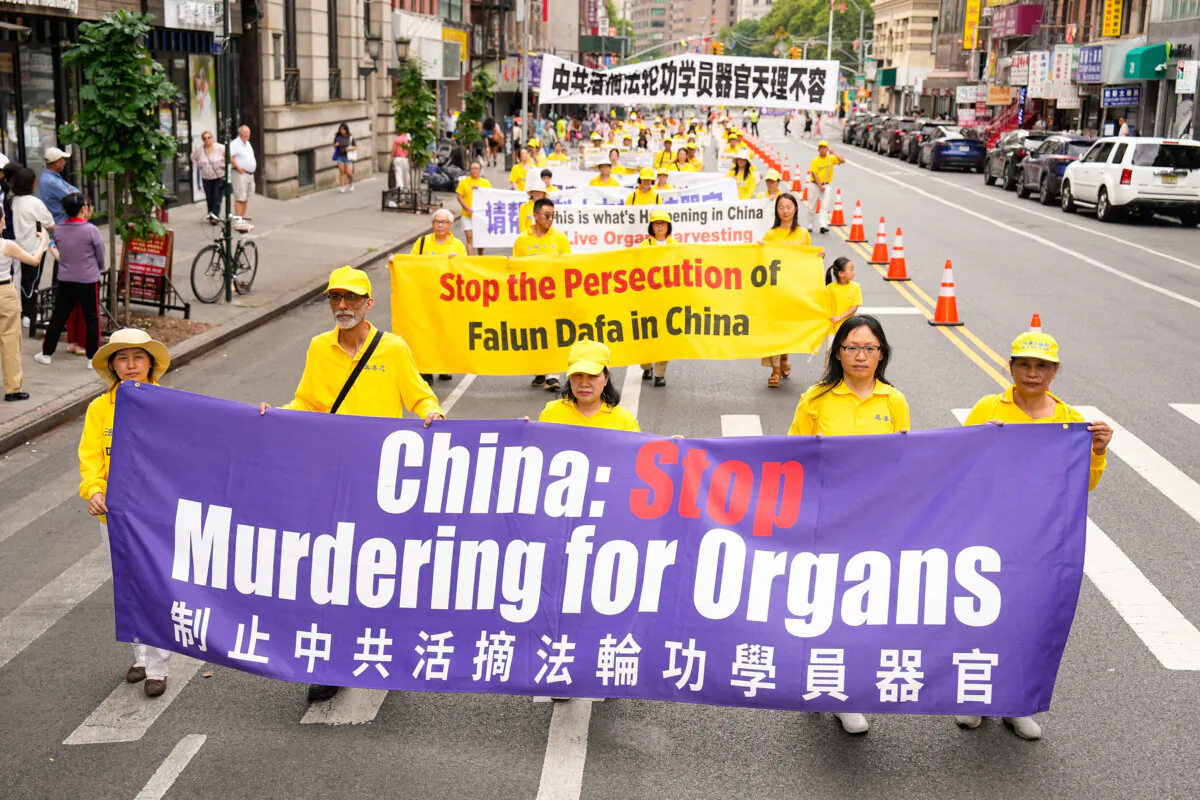 Falun Gong practitioners march during a parade calling for the end of the Chinese Communist Party's 25 years of ongoing persecution against the spiritual practice, in New York City on July 20, 2024. (Larry Dye/The Epoch Times)