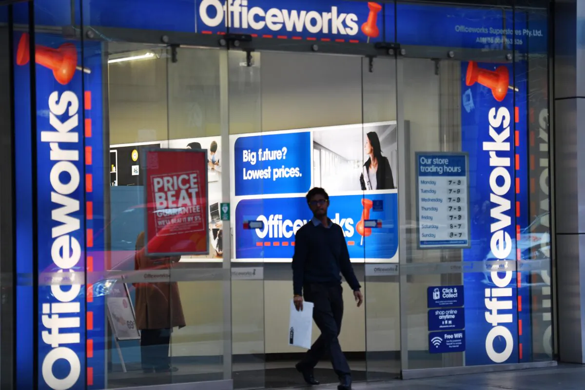 A man walks out of an Officeworks store in Sydney, Australia on July 9, 2018. (AAP Image/Mick Tsikas)