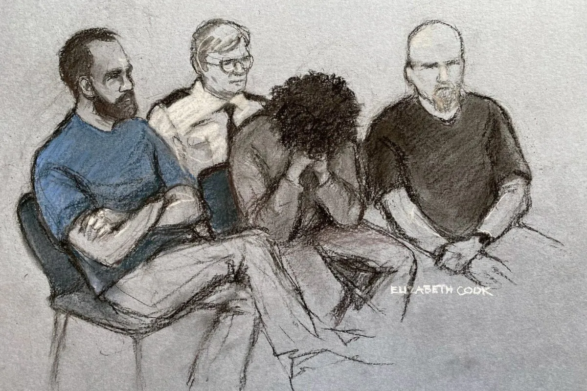Court artist drawing of 17-year-old Axel Rudakubana (C) covering his face as he appeared in the dock at Liverpool Crown Court charged with three counts of murder, 10 counts of attempted murder, and possession of a bladed article, following a knife attack at a Taylor Swift-themed holiday club in Southport, on Aug. 1, 2024. (Elizabeth Cook/PA Wire)
