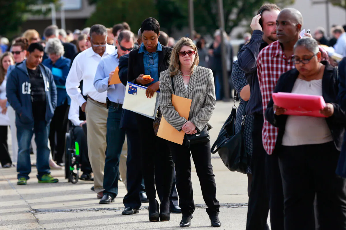 People wait in line to enter the Nassau County Mega Job Fair at Nassau Veterans Memorial Coliseum in Uniondale, New York, on Oct. 7, 2014. (Shannon Stapleton/Reuters)