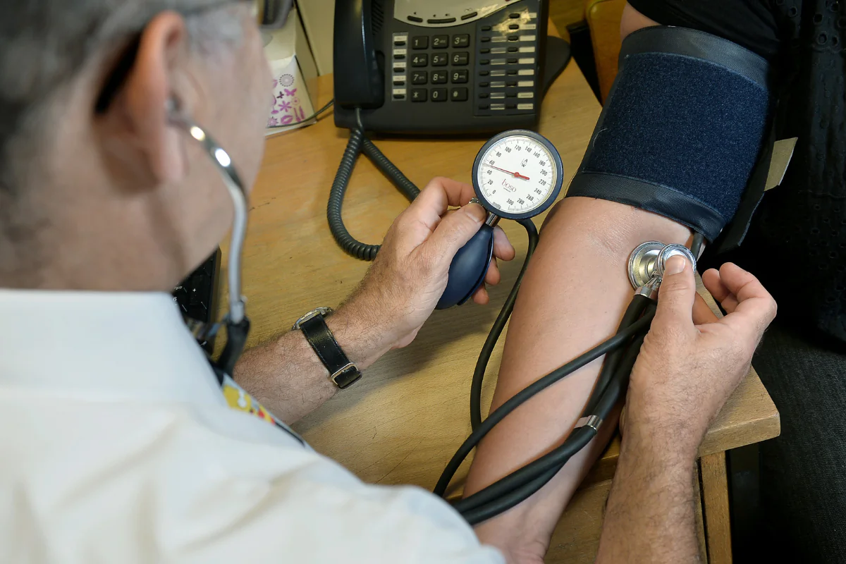A doctor checking a patient's blood pressure at the Temple Fortune Health Centre GP Practice near Golders Green, London, England, on July 29, 2024. (Anthony Devlin/PA Wire)

