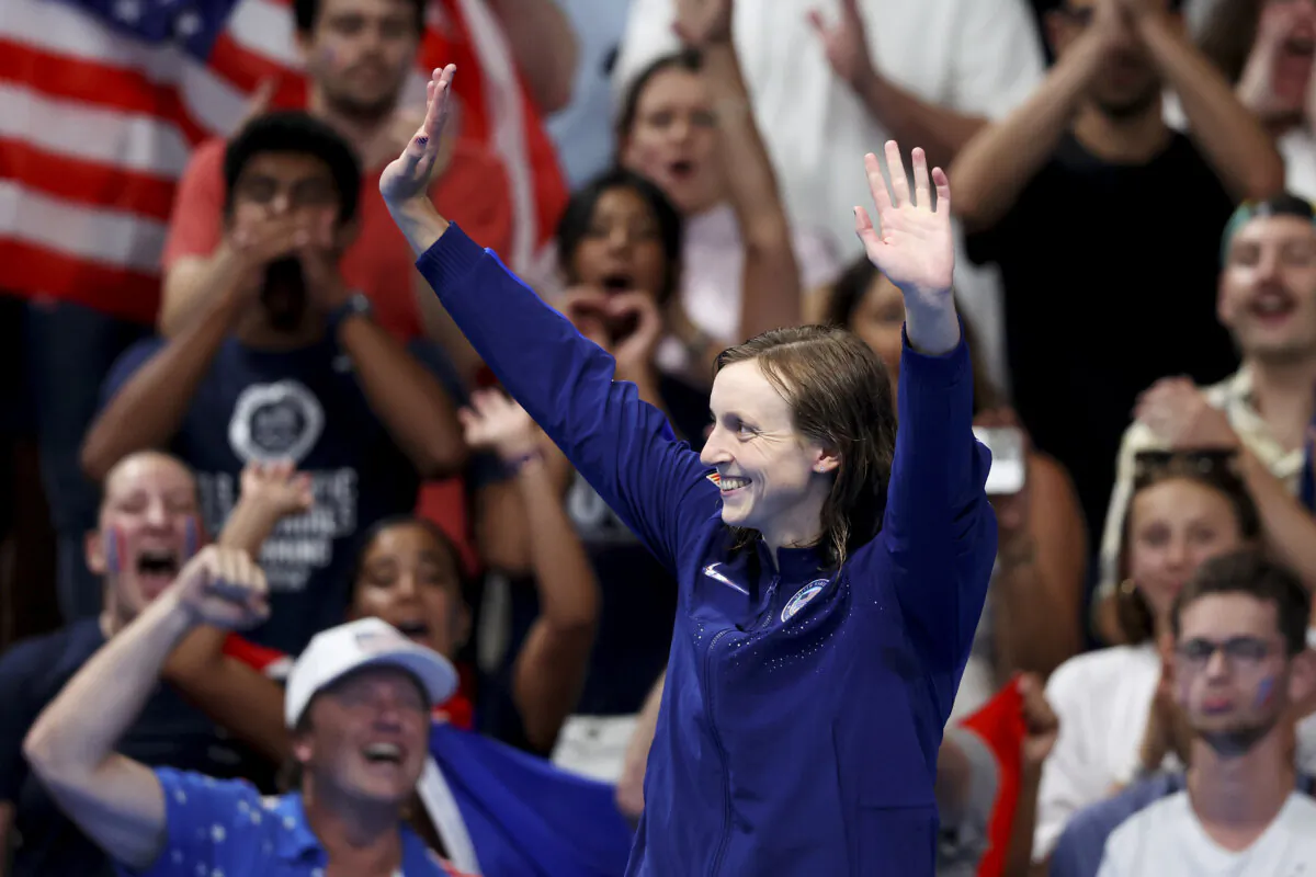 Gold Medalist Katie Ledecky of Team United States celebrates on the podium during the Swimming medal ceremony after the Women's 1500-Meter Freestyle Final on day five of the Olympic Games Paris 2024 at Paris La Defense Arena in Nanterre, France, on July 31, 2024. (Sarah Stier/Getty Images)