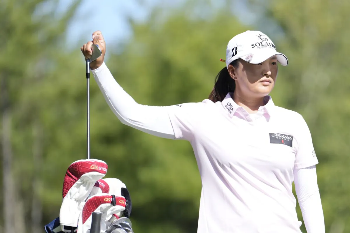 Jin Young Ko of South Korea selects a club during the third round of the FM Championship 2024 at TPC Boston in Norton, Mass., on August 31, 2024. (Raj Mehta/Getty Images)
