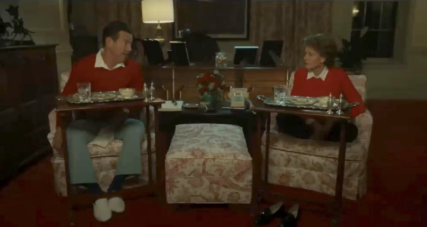 man and woman in red sweaters having dinner in Reagan