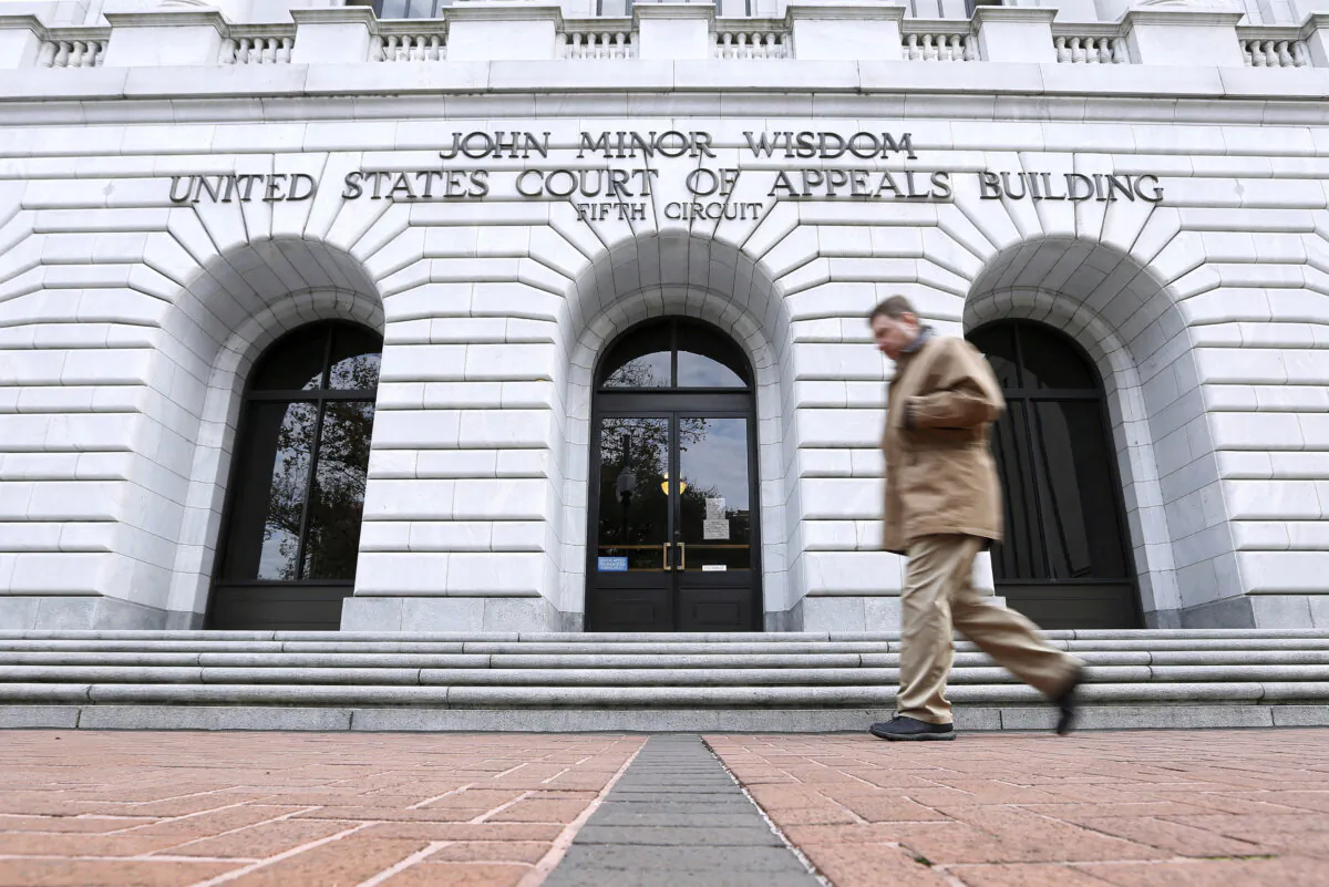 A man walks in front of the 5th U.S. Circuit Court of Appeals in New Orleans, in a file image. (Jonathan Bachman/AP Photo)
