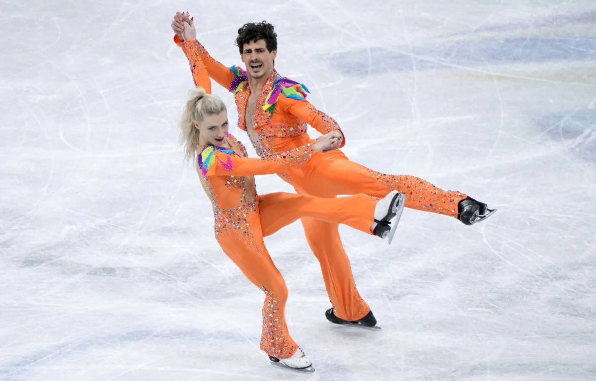 Piper Gilles and Paul Poirier of Canada perform their rhythm dance at the Olympic Winter Games in Beijing, on Feb. 12, 2022. (The Canadian Press/Paul Chiasson)