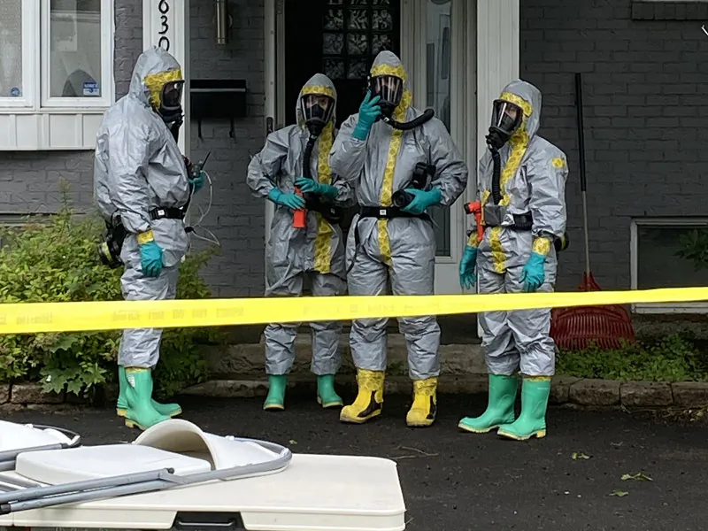 RCMP officers are seen outside a home in Drummondville, Que., during a raid of a clandestine laboratory on Aug. 1, 2024. (RCMP handout photo)
