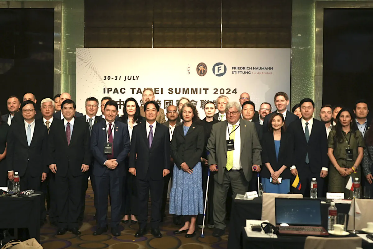Taiwanese President Lai Ching-te (centre left), poses for photos at a gathering of the largest delegation of foreign lawmakers to visit Taiwan in Taipei, Taiwan, on July 30, 2024. The Inter-Parliamentary Alliance on China (IPAC) deligation is a group of hundreds of lawmakers from 35 countries concerned about how democracies approach Beijing. (AP Photo/Dake Kang)