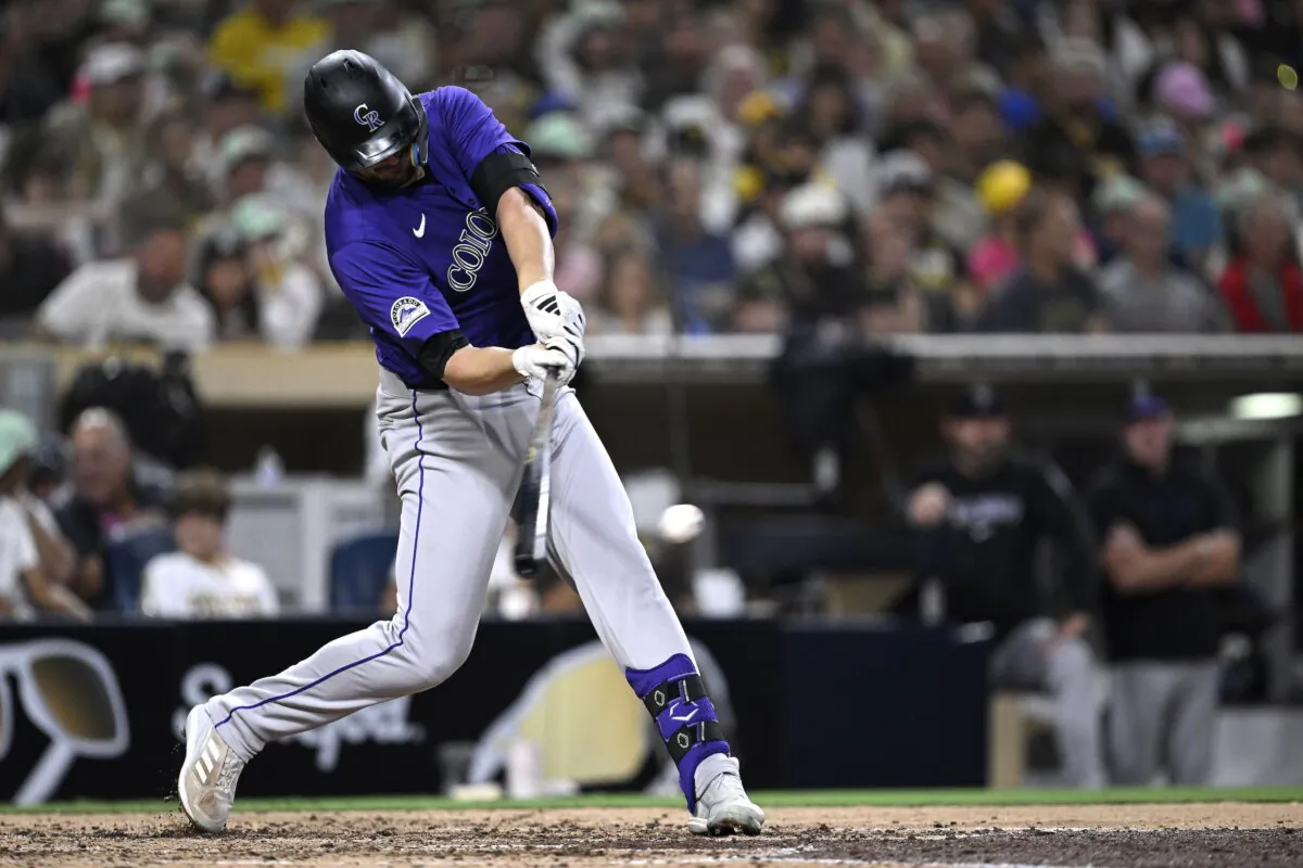Kris Bryant (23) of the Colorado Rockies hits a two-RBI single against the San Diego Padres during the sixth inning in San Diego on Aug. 2, 2024. (Orlando Ramirez/Getty Images)