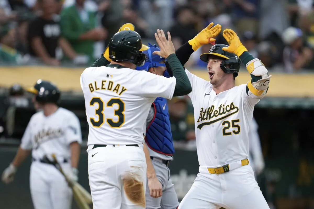 Oakland Athletics’ Brent Rooker (R) celebrates with JJ Bleday (33) after hitting a two-run home run against the Los Angeles Dodgers during the fifth inning of a baseball game in Oakland, Calif., on Aug. 2, 2024. (Godofredo A. Vásquez/AP Photo)