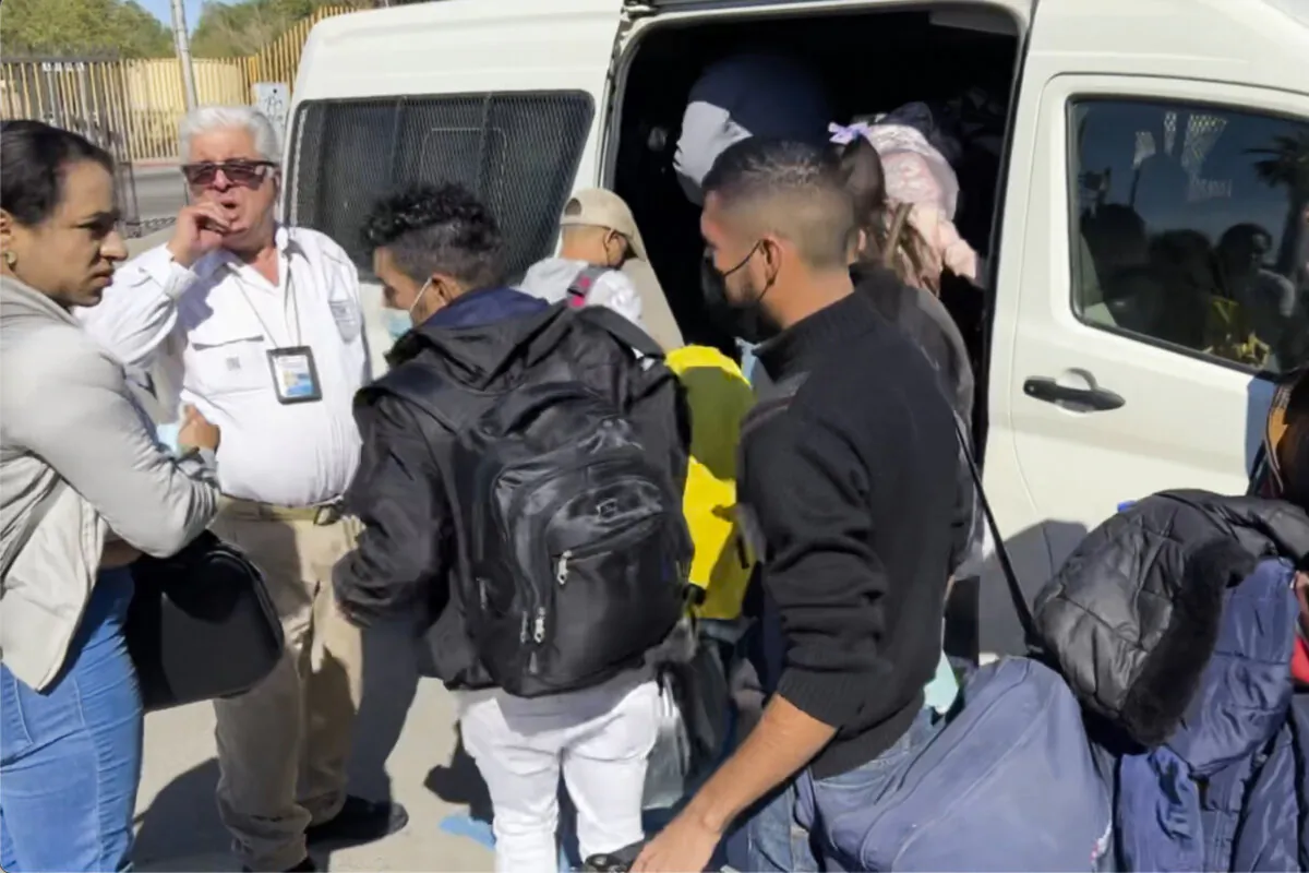 A Mexican immigration official waits as migrants with U.S.-approved parole authority load into his van ready to cross into the United States via a port of entry. (Courtesy of Todd Bensman/Center for Immigration Studies)