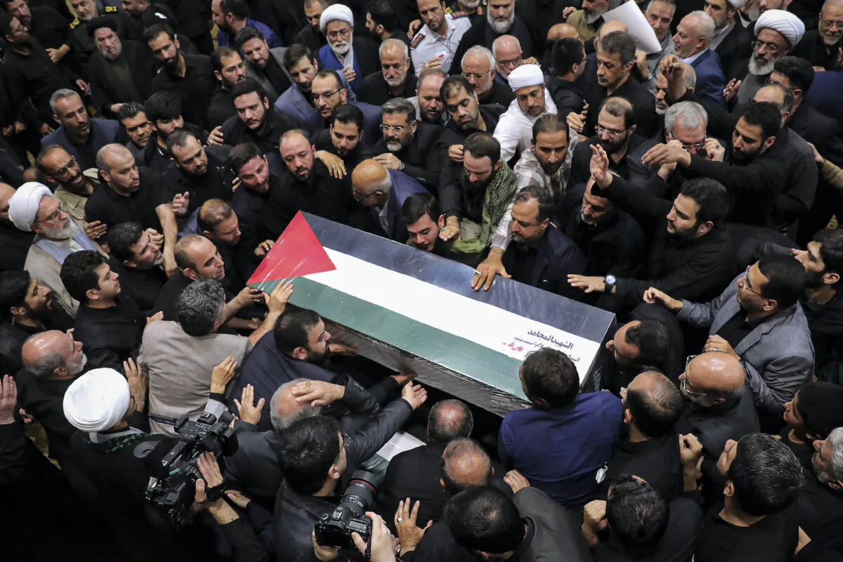 People gather during a funeral procession for Ismail Haniyeh, political leader of terror group Hamas, and his bodyguard, who were killed on July 31, 2024, in Tehran, Iran, on Aug. 1, 2024. (Office of the Iranian Supreme Leader/Getty Images)