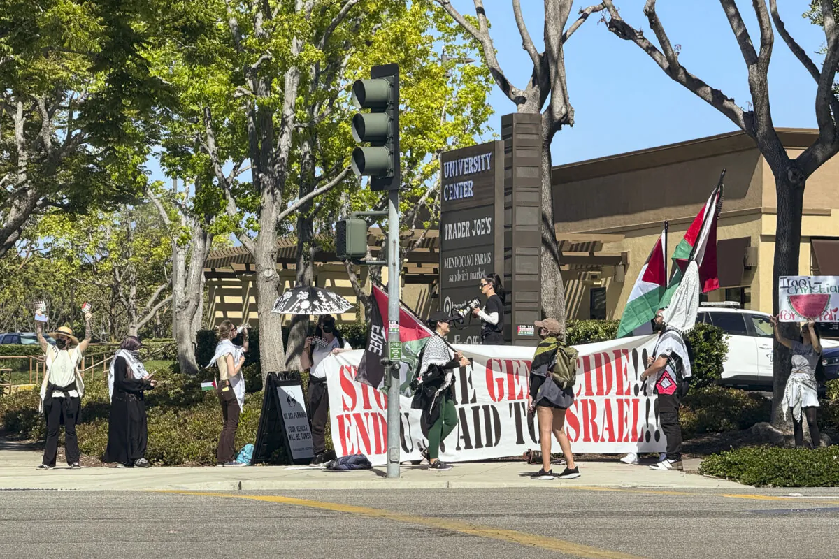 Student protesters set up at the intersection of Campus Drive and W. Peltason Drive near the University of California–Irvine in Irvine, Calif., on April 29, 2024. (Rudy Blalock/The Epoch Times)