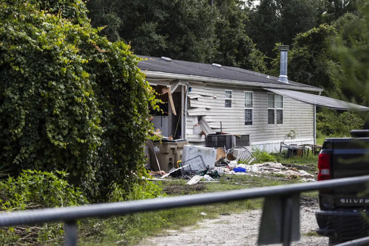 Law enforcement investigate the home where a sheriff’s deputy was killed and two other deputies were wounded Friday night in Eustis, Fla., on Aug. 3, 2024. (Willie J. Allen Jr./Orlando Sentinel via AP)