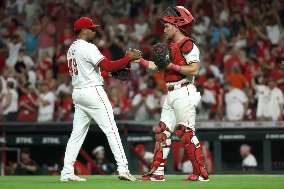 Alexis Diaz (43) of the Cincinnati Reds is congratulated by Tyler Stephenson (37) after closing out the game and earning save against the San Francisco Giants in Cincinnati on August 3, 2024. (Kirk Irwin/Getty Images)