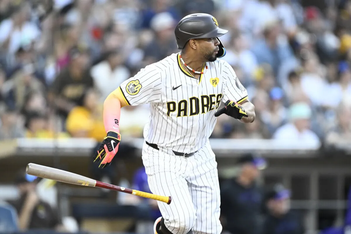 San Diego Padres' Xander Bogaerts hits an RBI single during the seventh inning of a baseball game against the Colorado Rockies in San Diego on Aug. 3, 2024. (Denis Poroy/AP Photo)