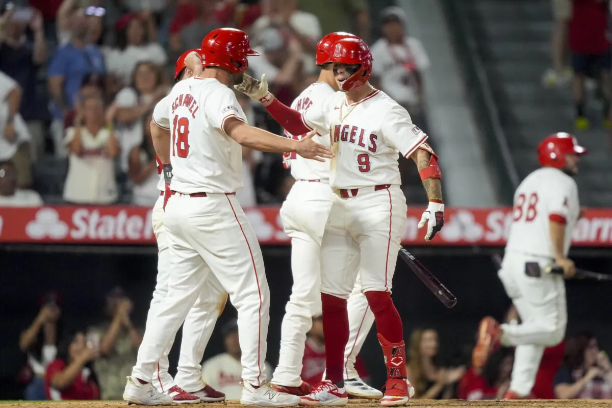 Los Angeles Angels' Zach Neto (9) celebrates with Nolan Schanuel (18). who also scored, after his go-ahead three-run home run during the seventh inning of a baseball game against the New York Mets in Anaheim, Calif., on Aug. 3, 2024. (Ryan Sun/AP Photo)