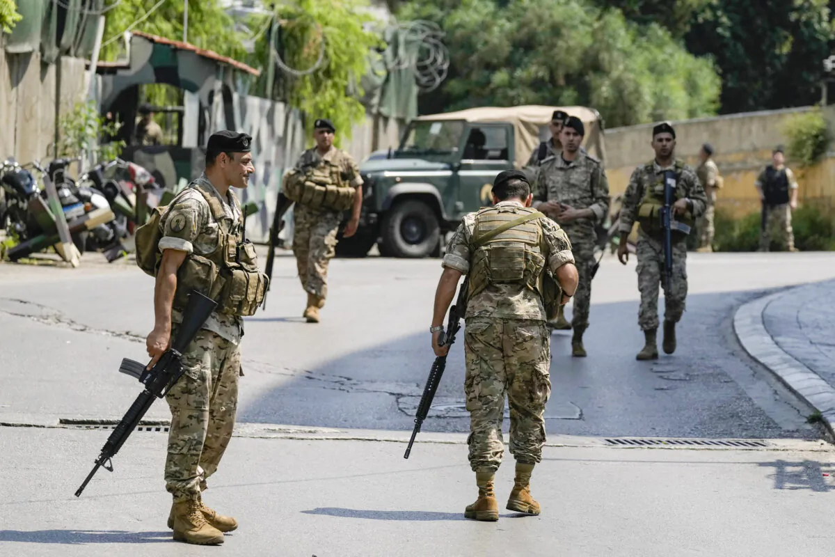 Lebanese security personnel stand guard on a road that leads to the U.S. Embassy in Awkar, a northern suburb of Beirut, Lebanon, on June 5, 2024. (Bilal Hussein/AP Photo)