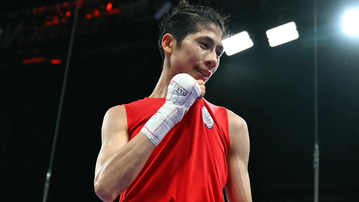 Taiwan's Lin Yu-Ting reacts after beating Bulgaria's Svetlana Kamenova Staneva in a quarter-final boxing match during the Paris 2024 Olympic Games at the North Paris Arena, in Villepinte, on Aug. 4, 2024. (Mohd Rasfan/AFP via Getty Images)