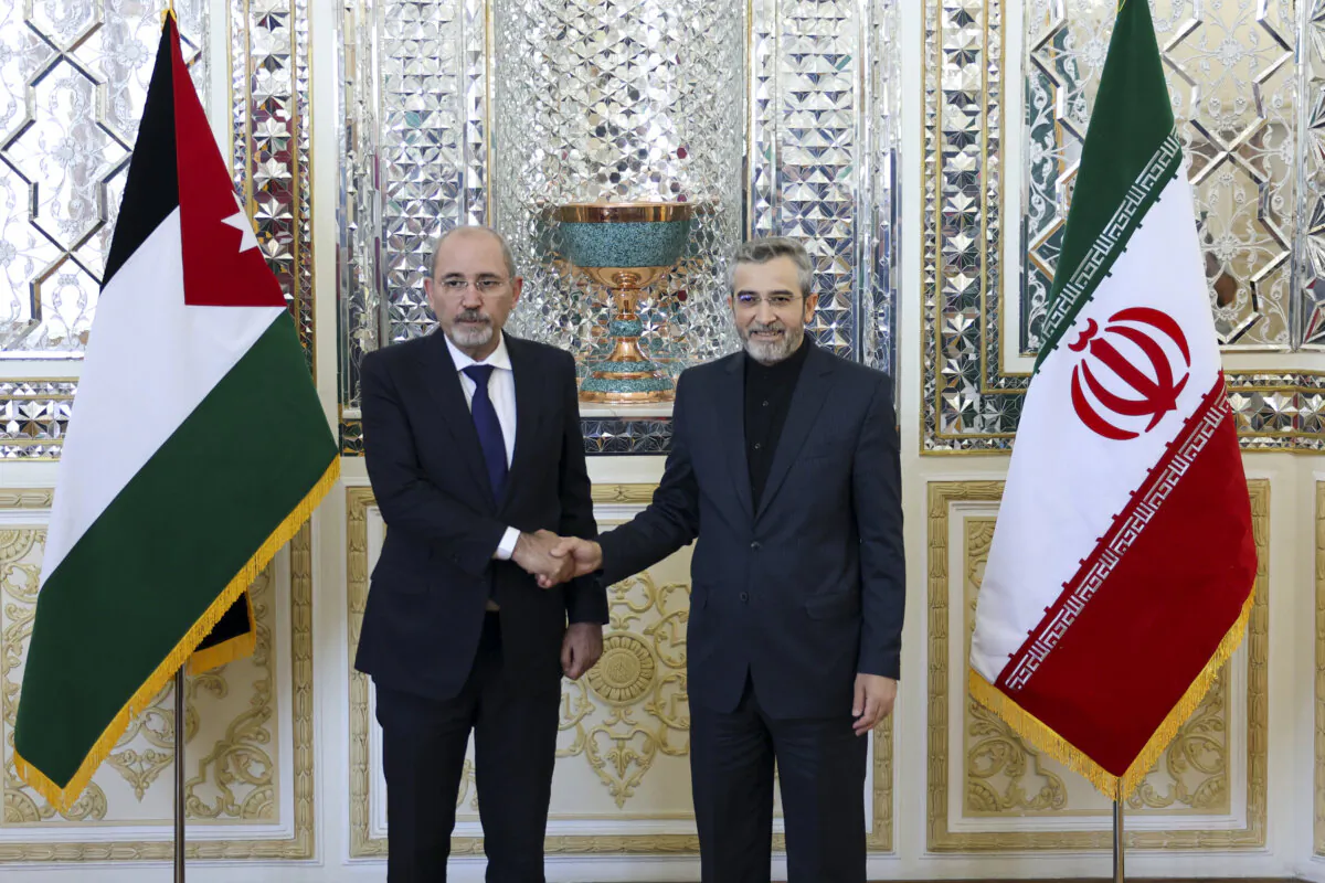 Iran's acting foreign minister Ali Bagheri (R) welcomes his Jordanian counterpart Ayman Safadi ahead of their meeting in Tehran, on Aug. 4, 2024. (AFP via Getty Images)